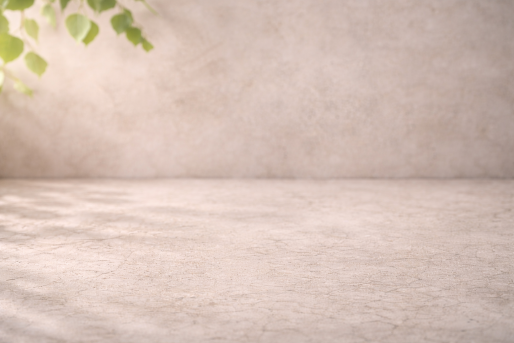 textured stone with hanging leaves